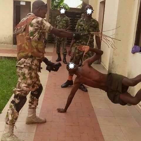 Nigerian soldiers beating up a man